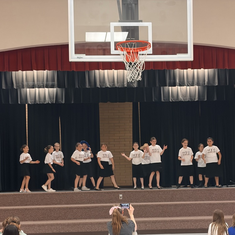 a line of students dancing