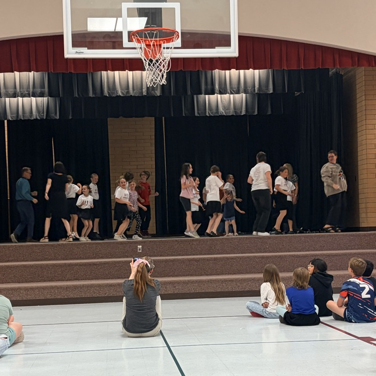 students and teachers dancing to The Boot Scootin Boogy