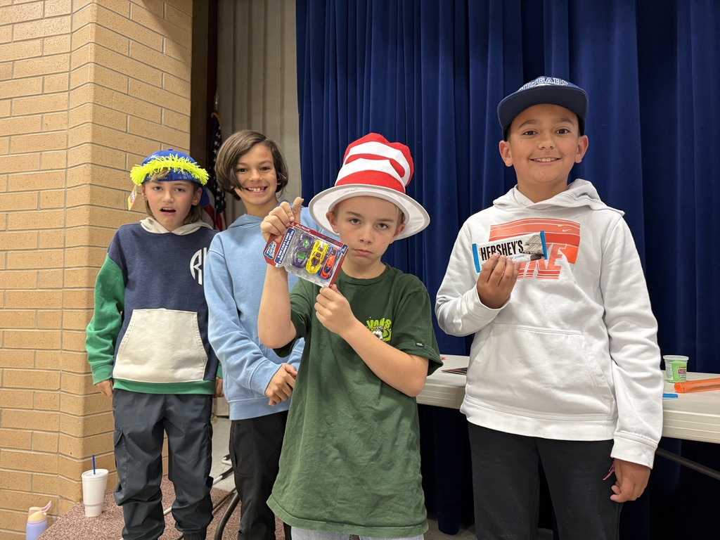 students posing with their prizes