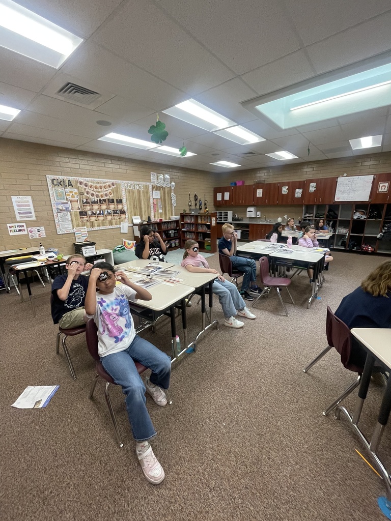 students posing with eye patches