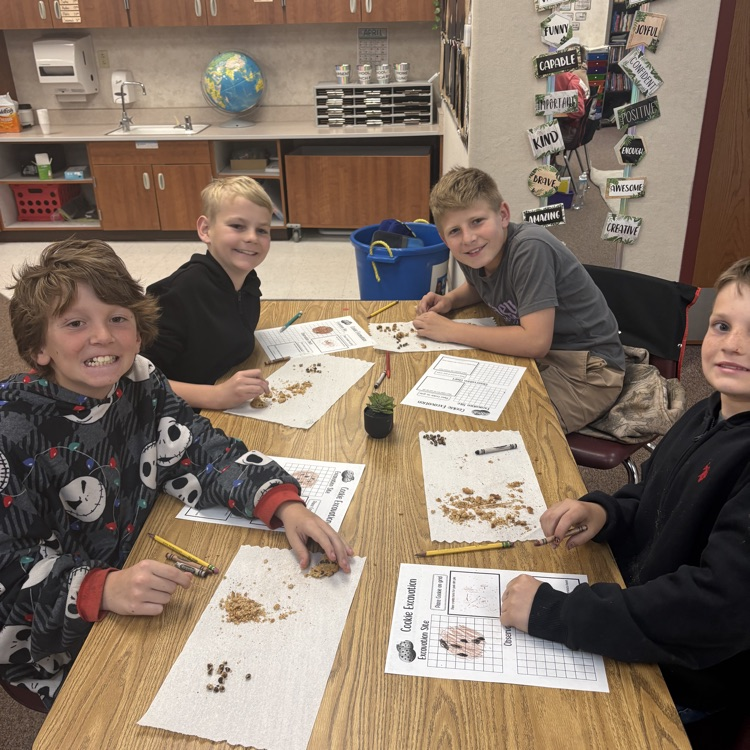 four boys with crushed cookies