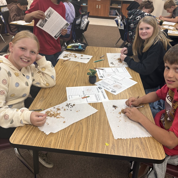 three students with crushed cookies