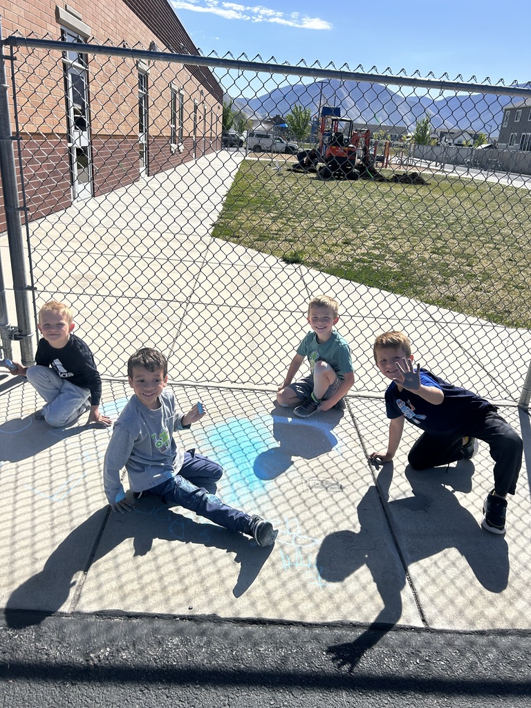students drawing with chalk