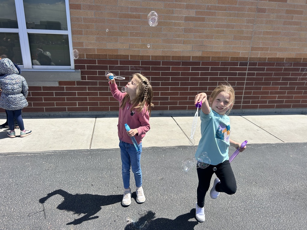 students playing with bubbles