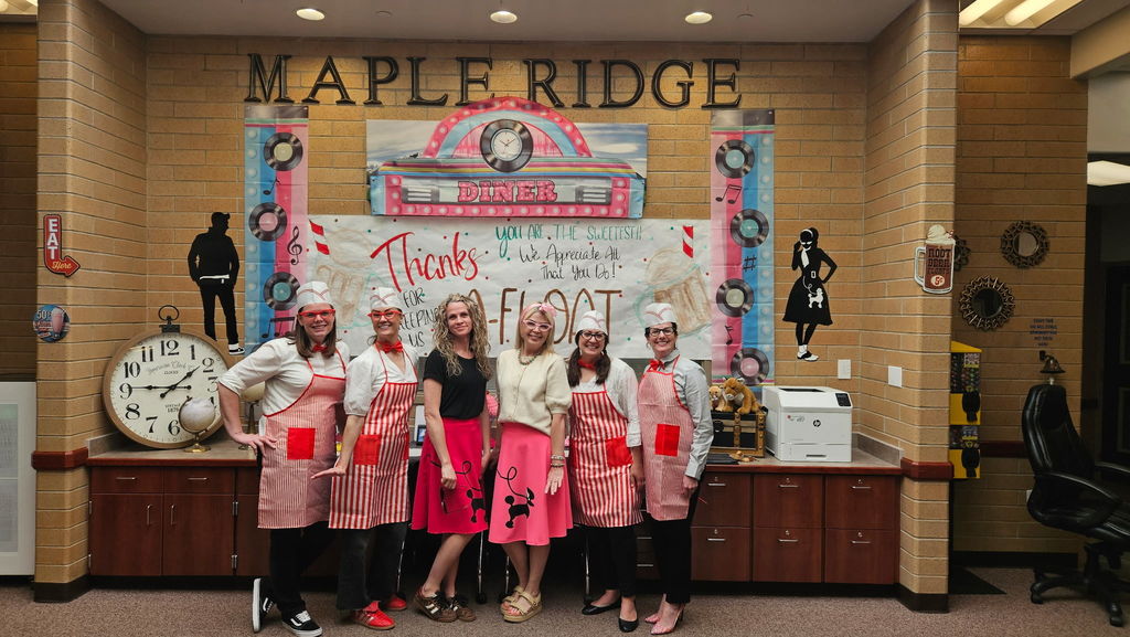 Maple Ridge office staff dressed in 50's diner outfits celebrating our front office secretaries.