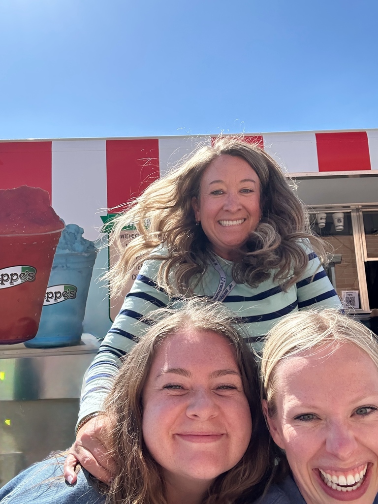 teachers smiling in front of the Zeppe's truck
