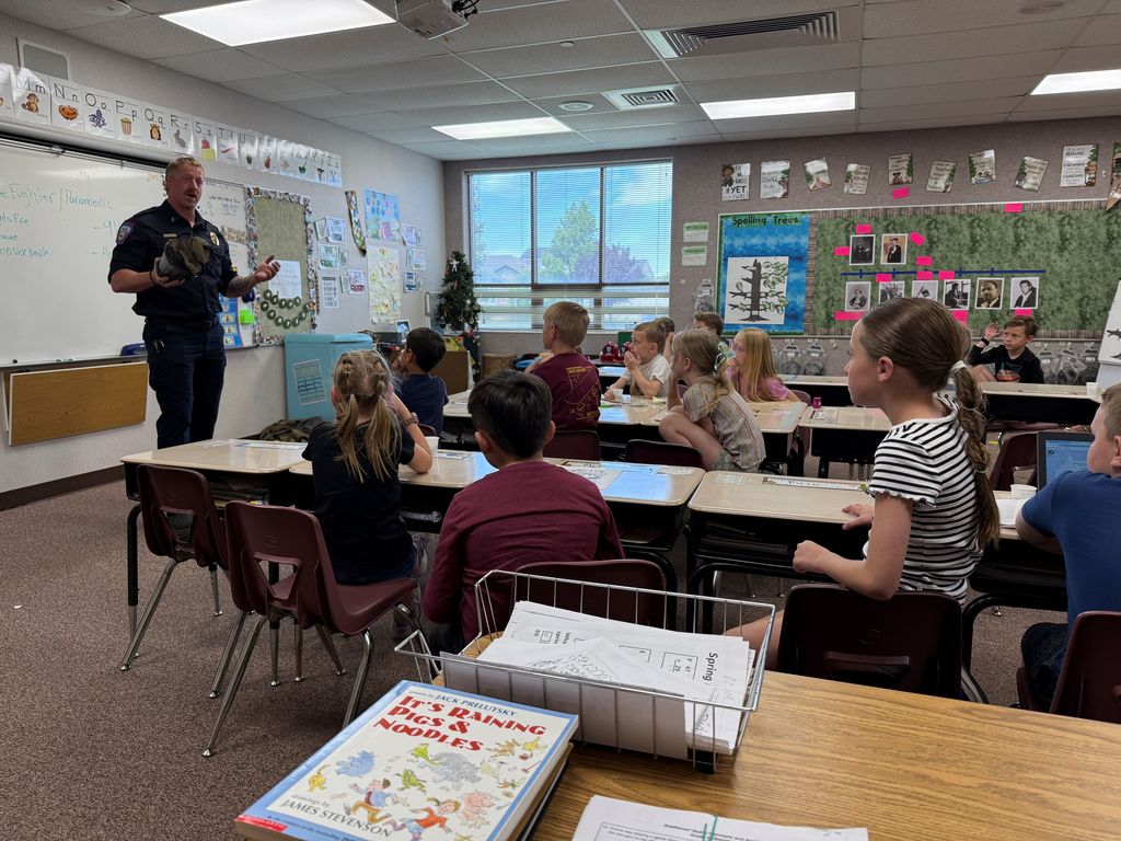 Students listening to a firefighter