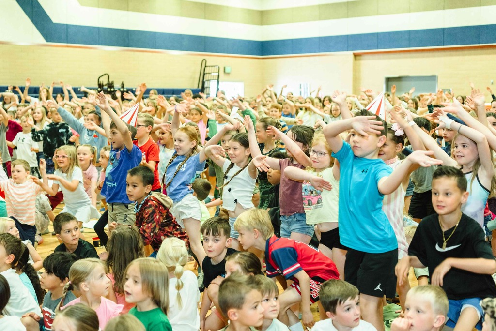 Kids dancing during the assembly.