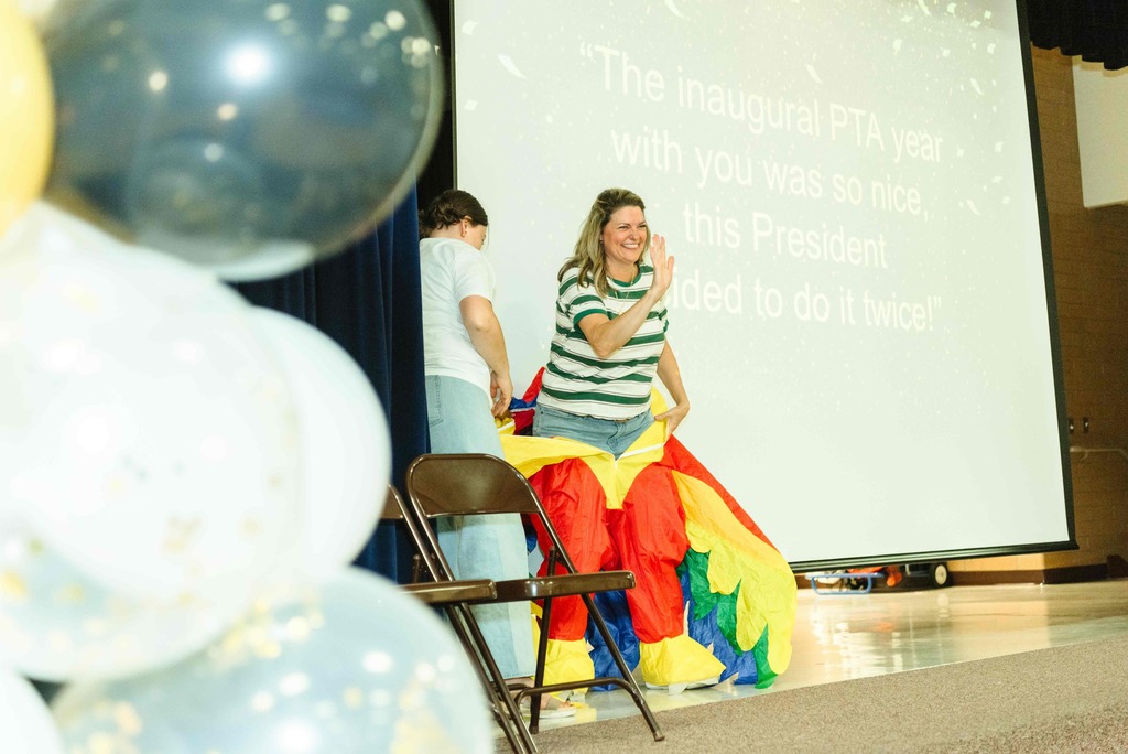 Mrs. Whyte stepping out of the frog costume.