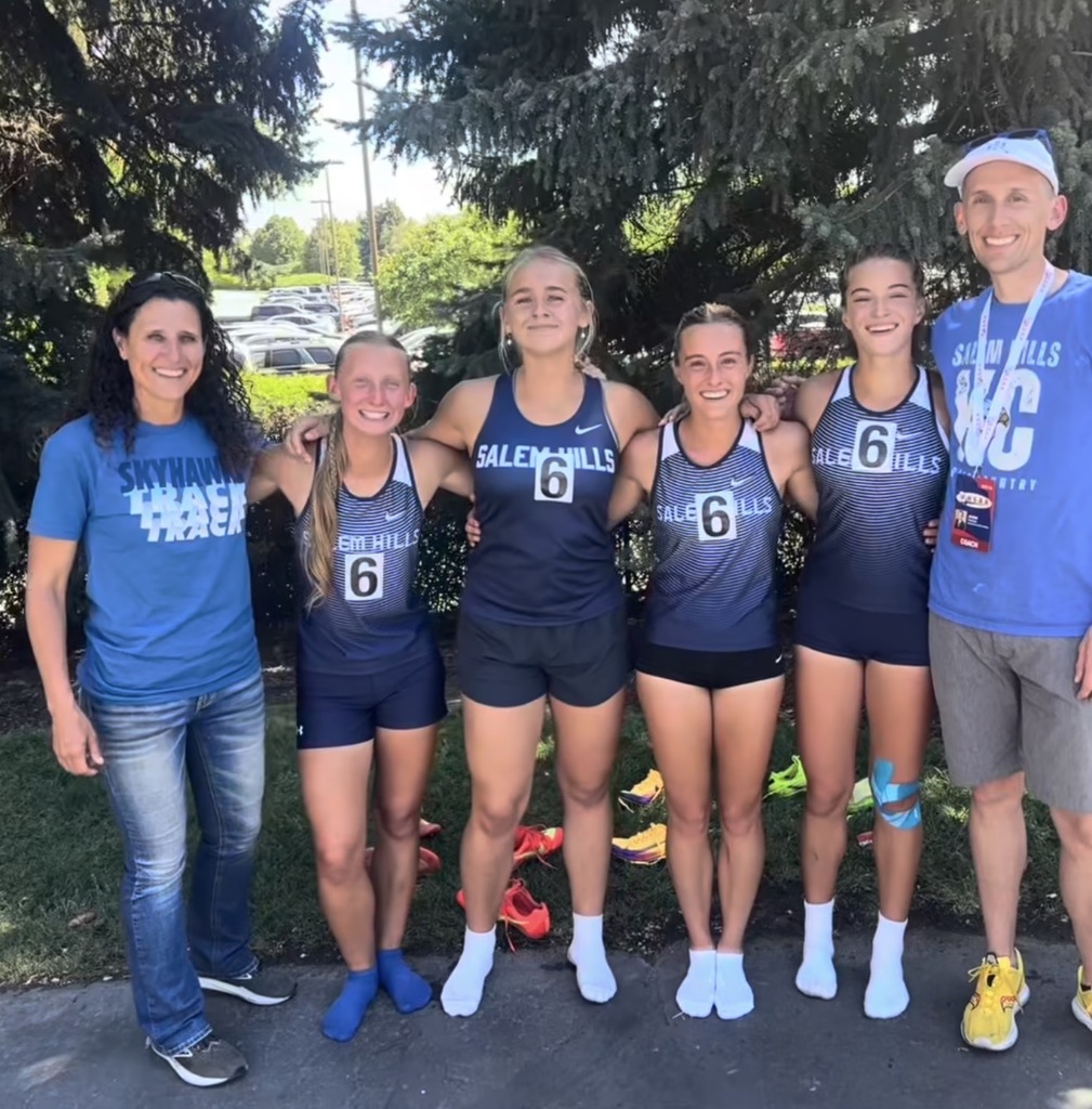 Coaches and girl's track team at state 2026