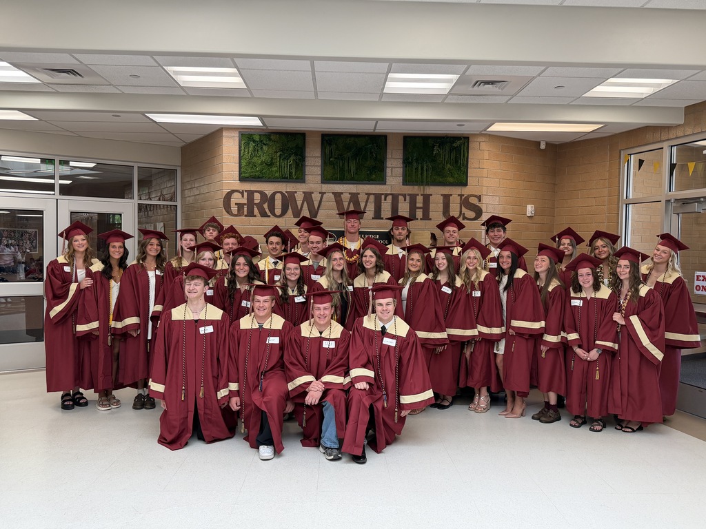 Former Maple Ridge students in their caps and gowns,