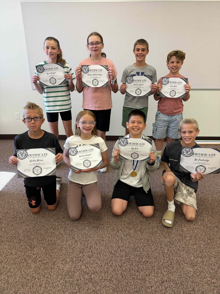 Students who scored in the top 50% of Mathletes in the world, holding their certificates.