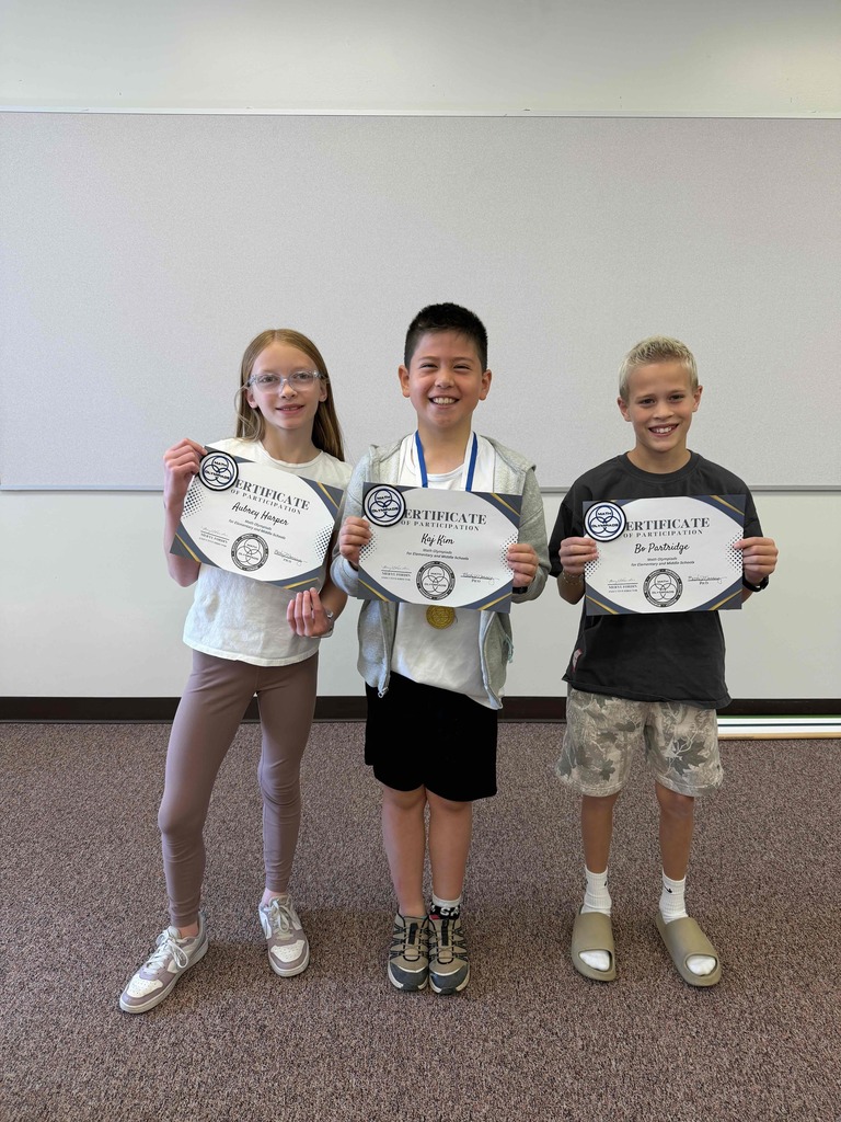 1st, 2nd and 3rd place Mathlete winners holding certificates.