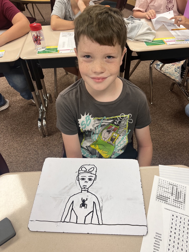 Student shows a drawing
