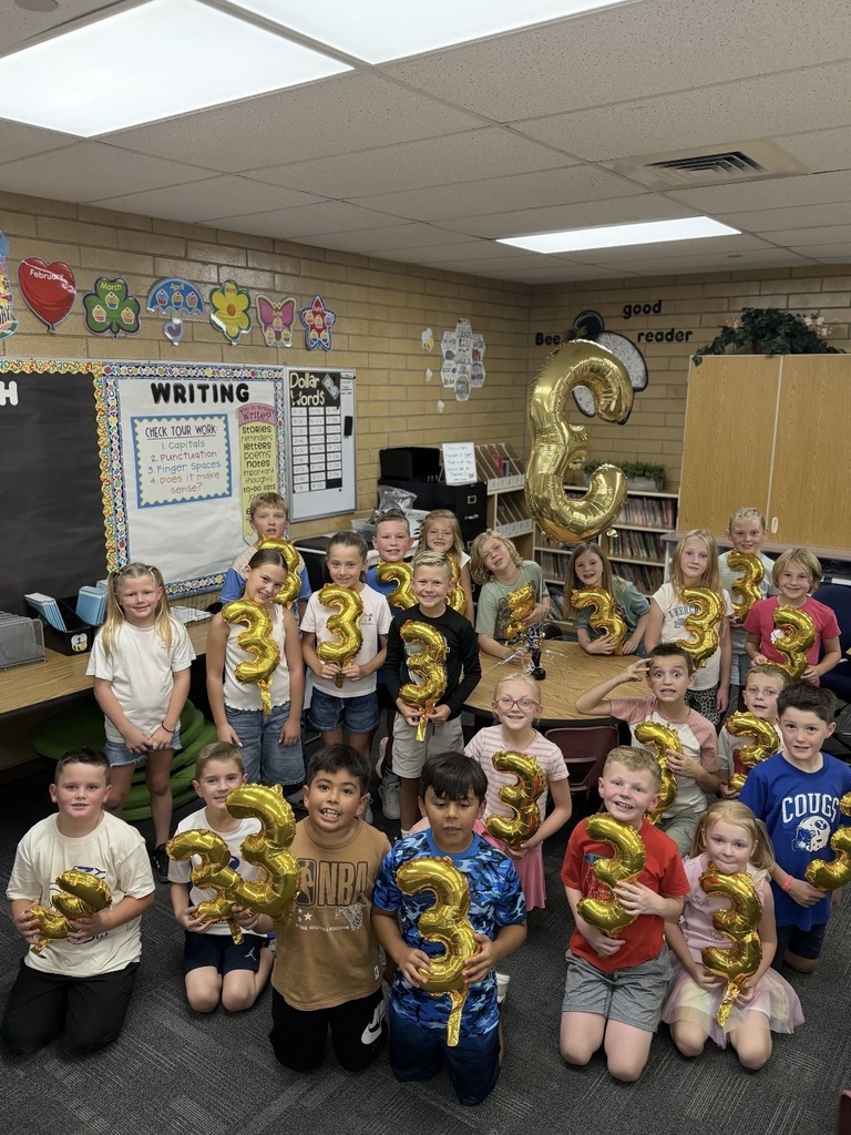 Happy third grade students