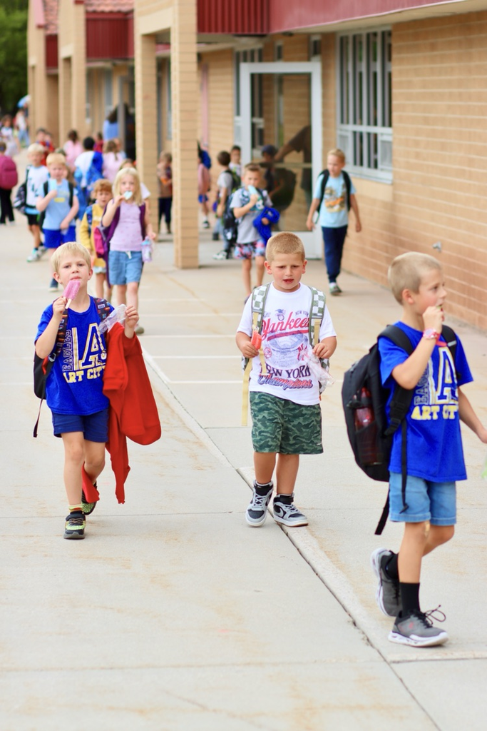 Students enjoy their treat on the way home from school.