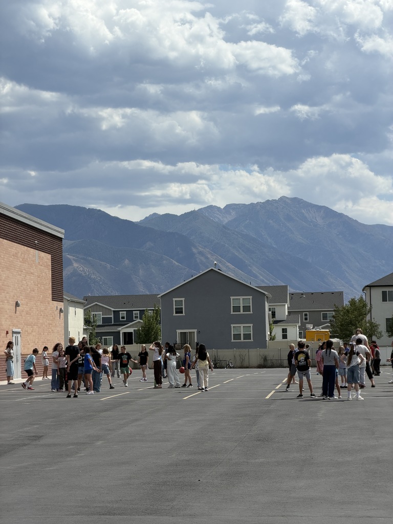 students playing four square
