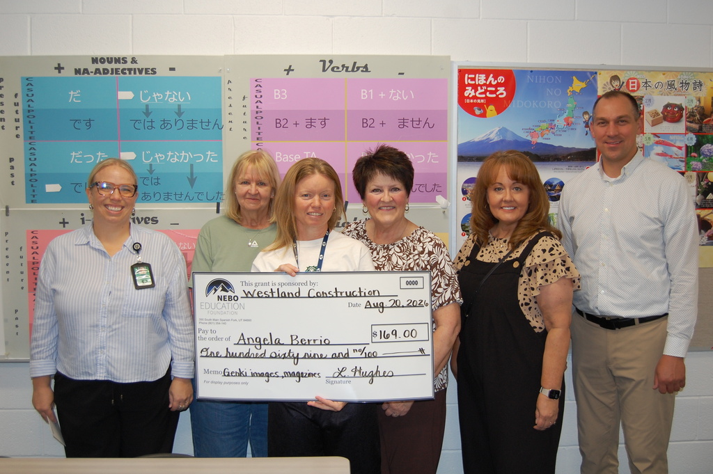 Angela Berrio receiving grant from NEF Board