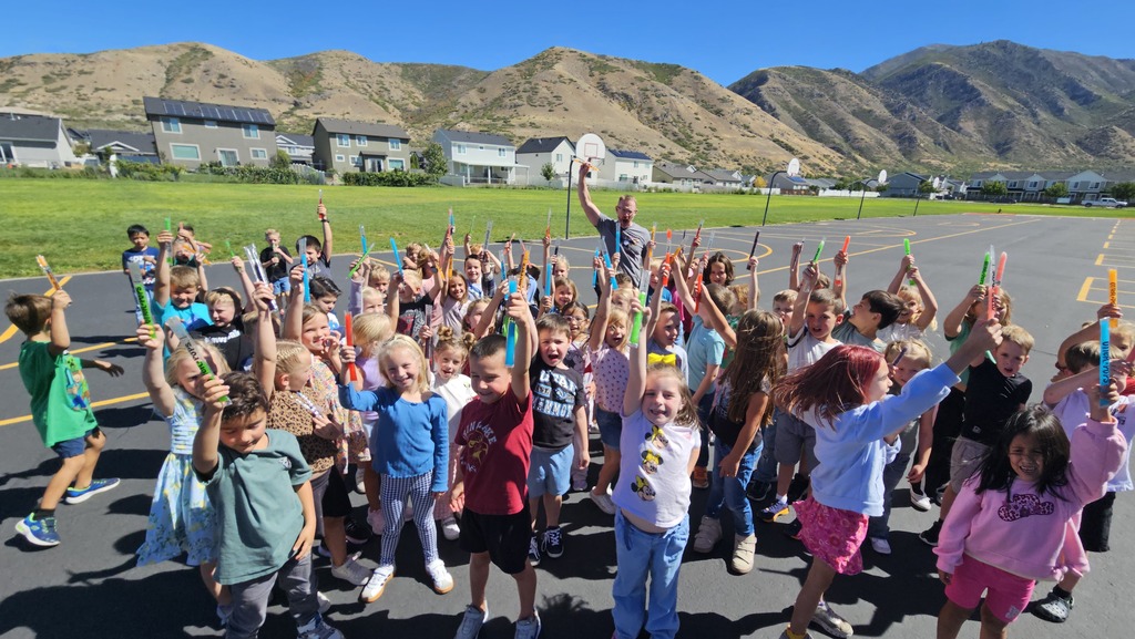 First graders holding up their popsicles