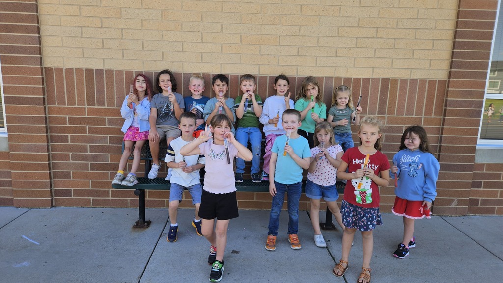 First graders eating popsicles