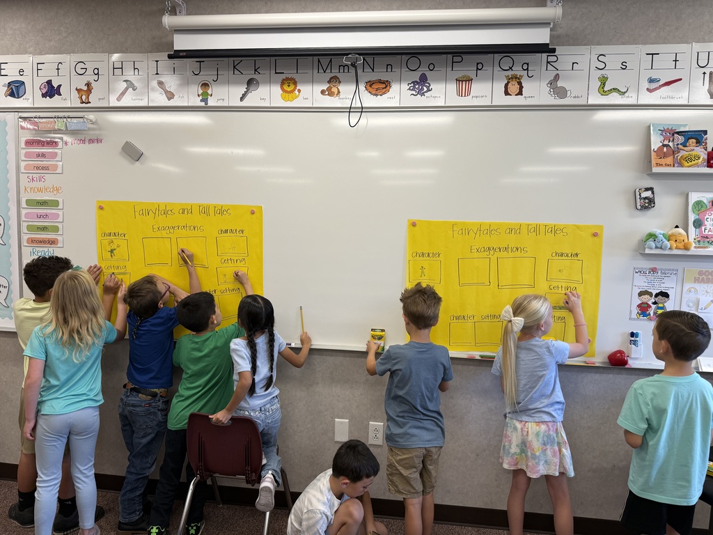 students working together at the whiteboard