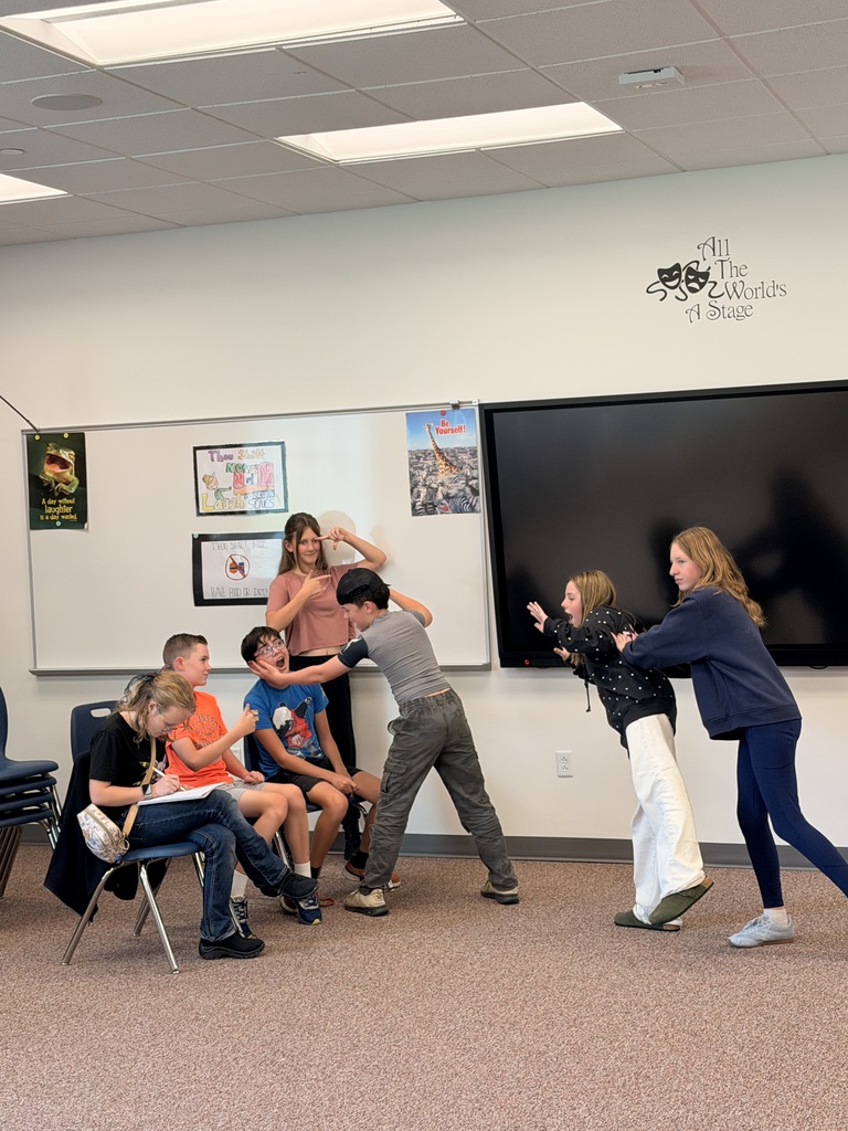 Students performing in the classroom 