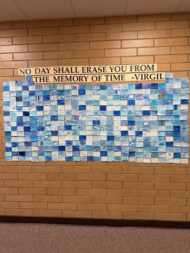 Mosaic of blue colored pieces of paper.