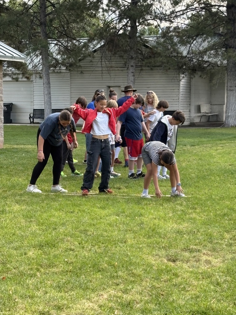 Fifth graders walking together on skis