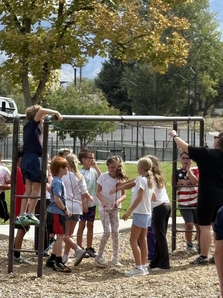 Fifth graders getting through a net web