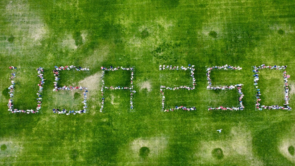 Students spell out USA 250 on the field