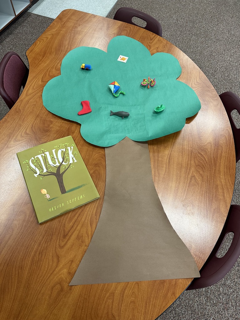 photo of book and a cut out paper tree