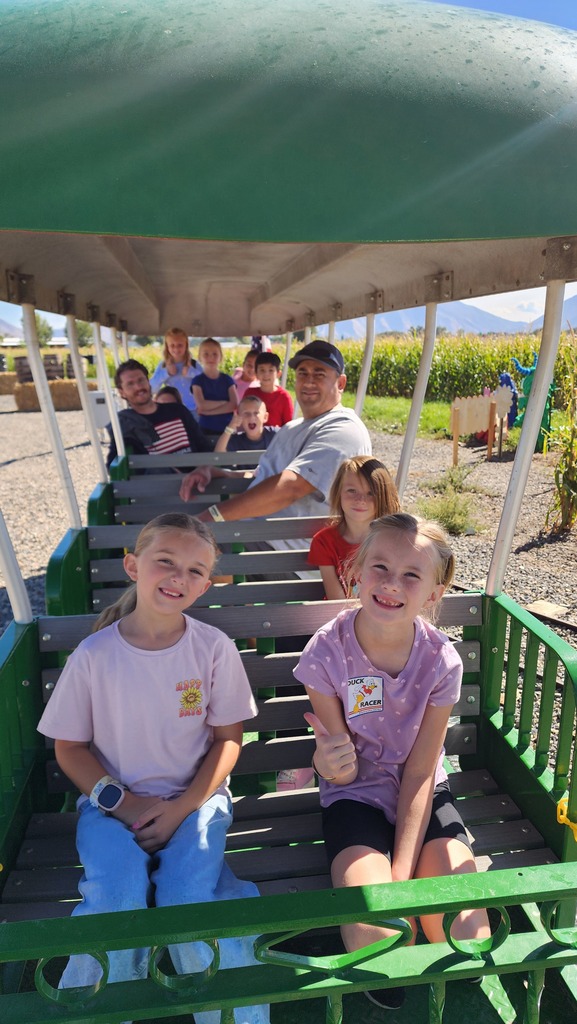Students enjoying a variety of fun activities and attractions during their visit to Cornbelly’s.