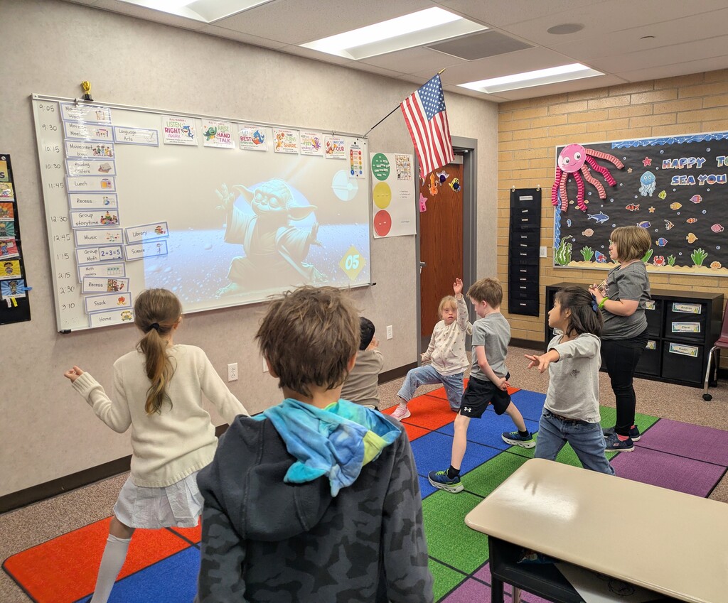 students doing a Disney-inspired yoga break 
