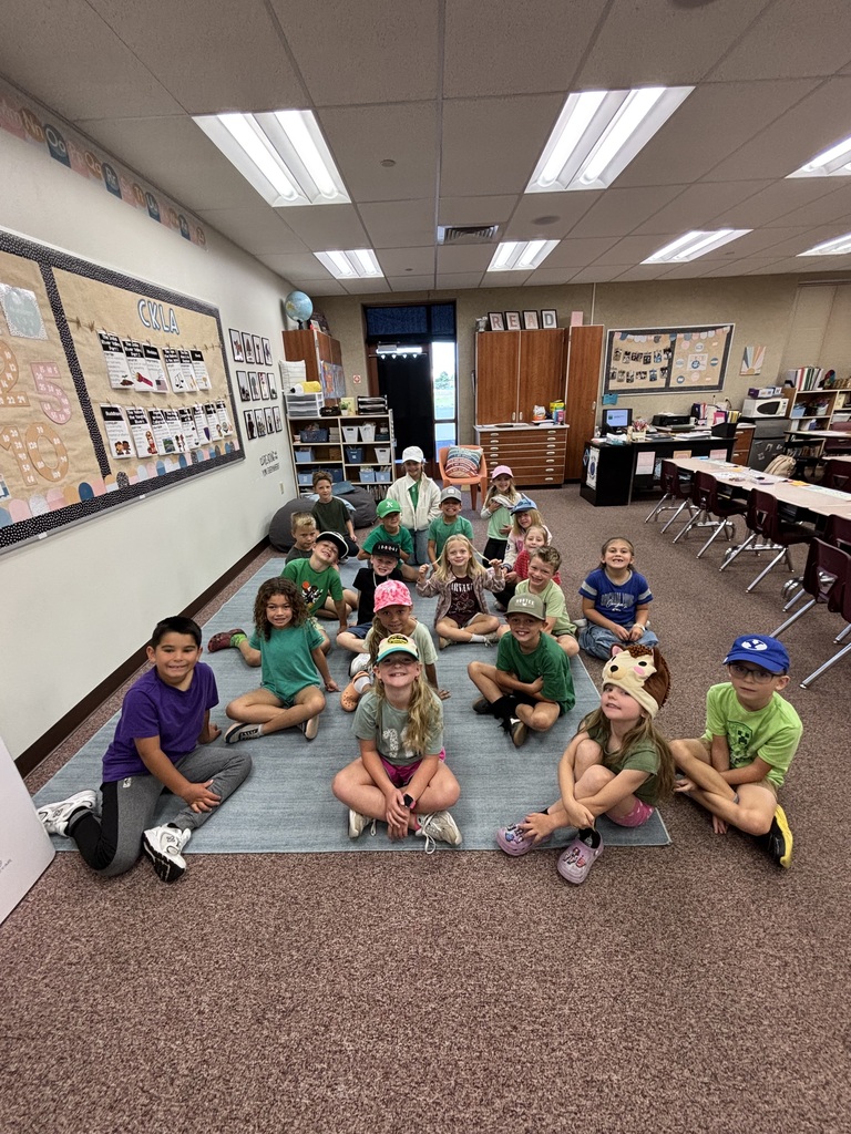 Foothills Elementary students participating in Road Safety Day during Ribbon Week. Students are wearing green clothing and a variety of hats to show their support for road safety.