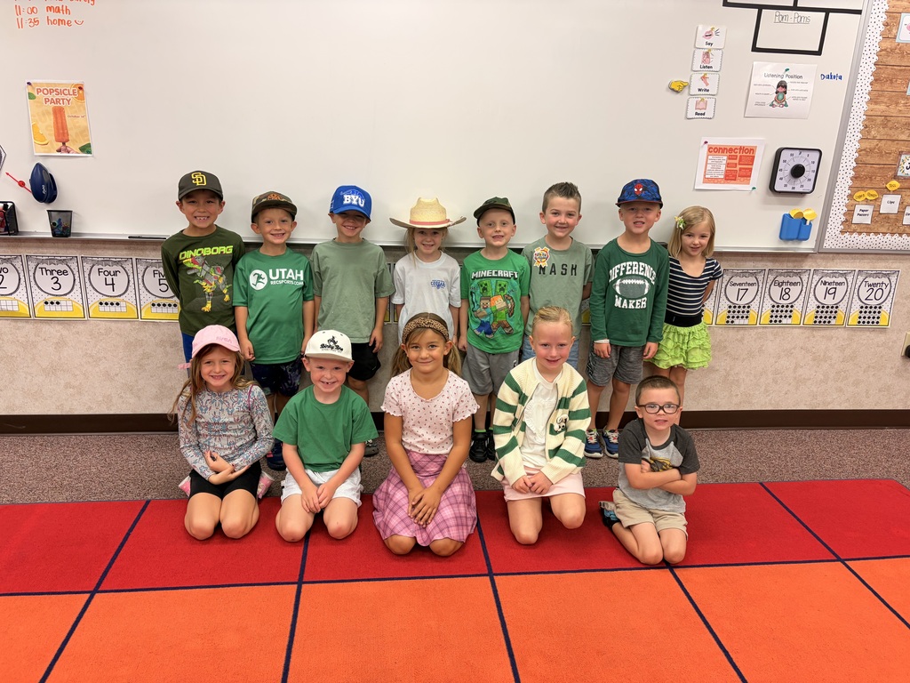 Foothills Elementary students participating in Road Safety Day during Ribbon Week. Students are wearing green clothing and a variety of hats to show their support for road safety.