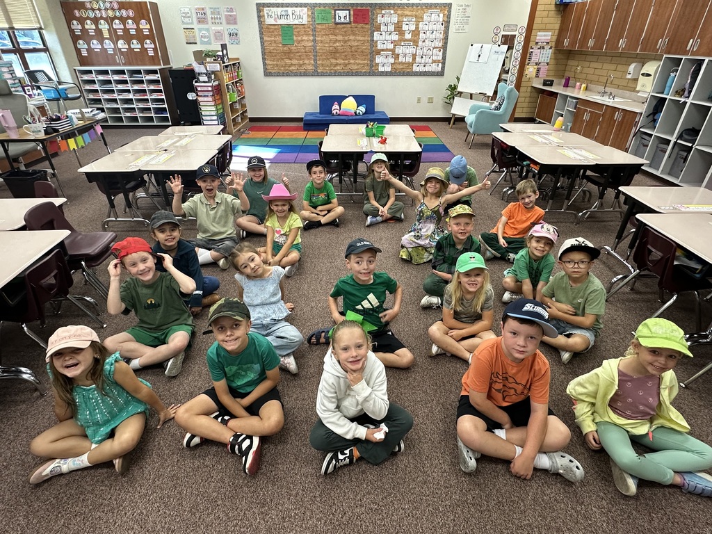 Foothills Elementary students participating in Road Safety Day during Ribbon Week. Students are wearing green clothing and a variety of hats to show their support for road safety.