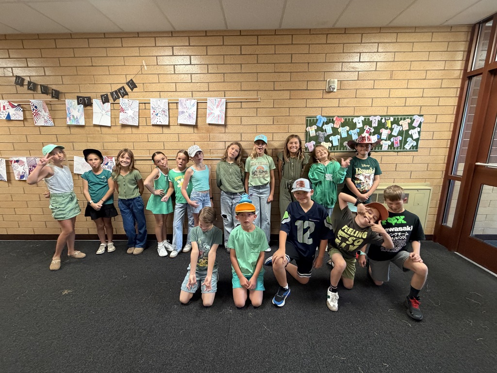 Foothills Elementary students participating in Road Safety Day during Ribbon Week. Students are wearing green clothing and a variety of hats to show their support for road safety.