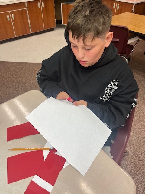 Fifth-grade students showing their Maya-inspired masks.
