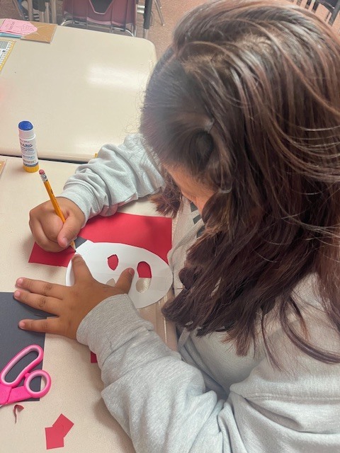 Fifth-grade students showing their Maya-inspired masks.