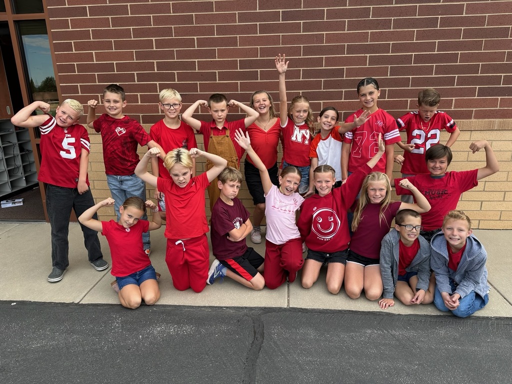 Students wearing red and enjoying donuts together for Drug Prevention Day.