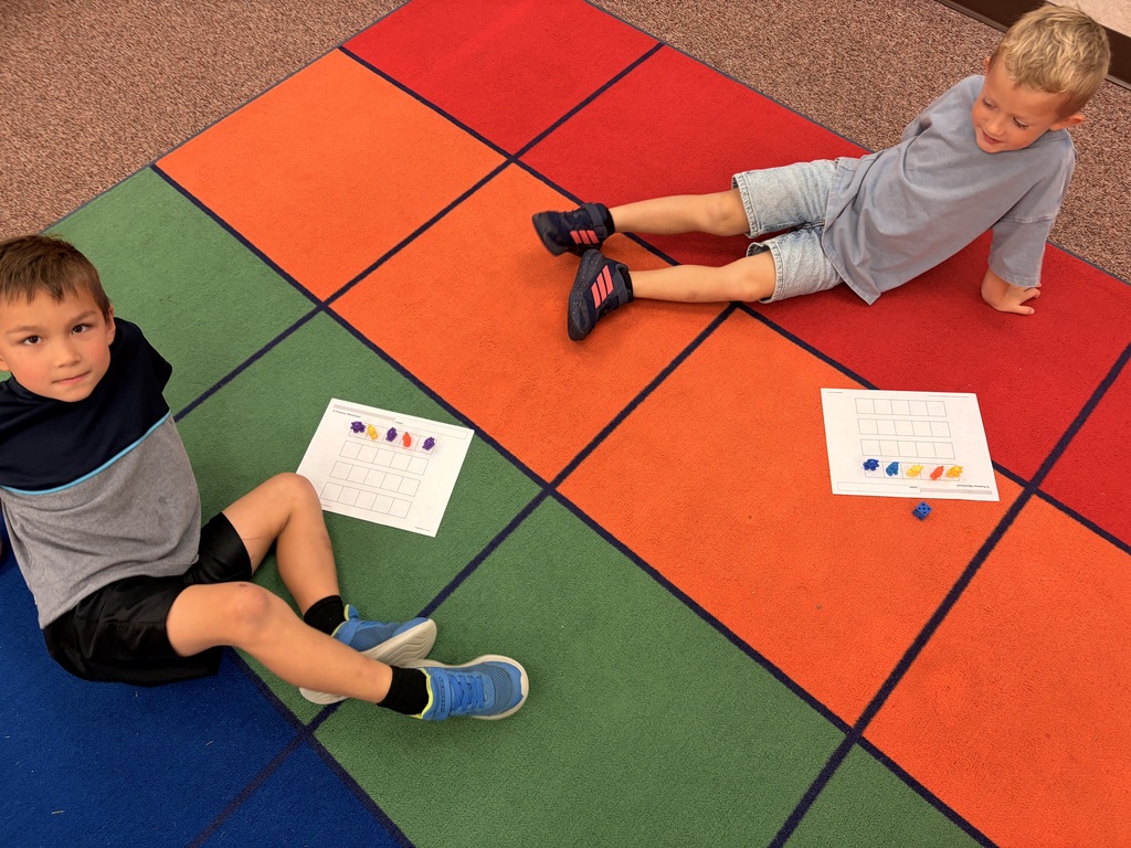 Kindergarten students using counting strategies in math.