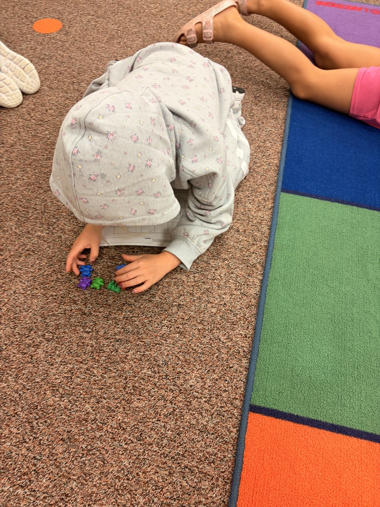 Kindergarten students using counting strategies in math.