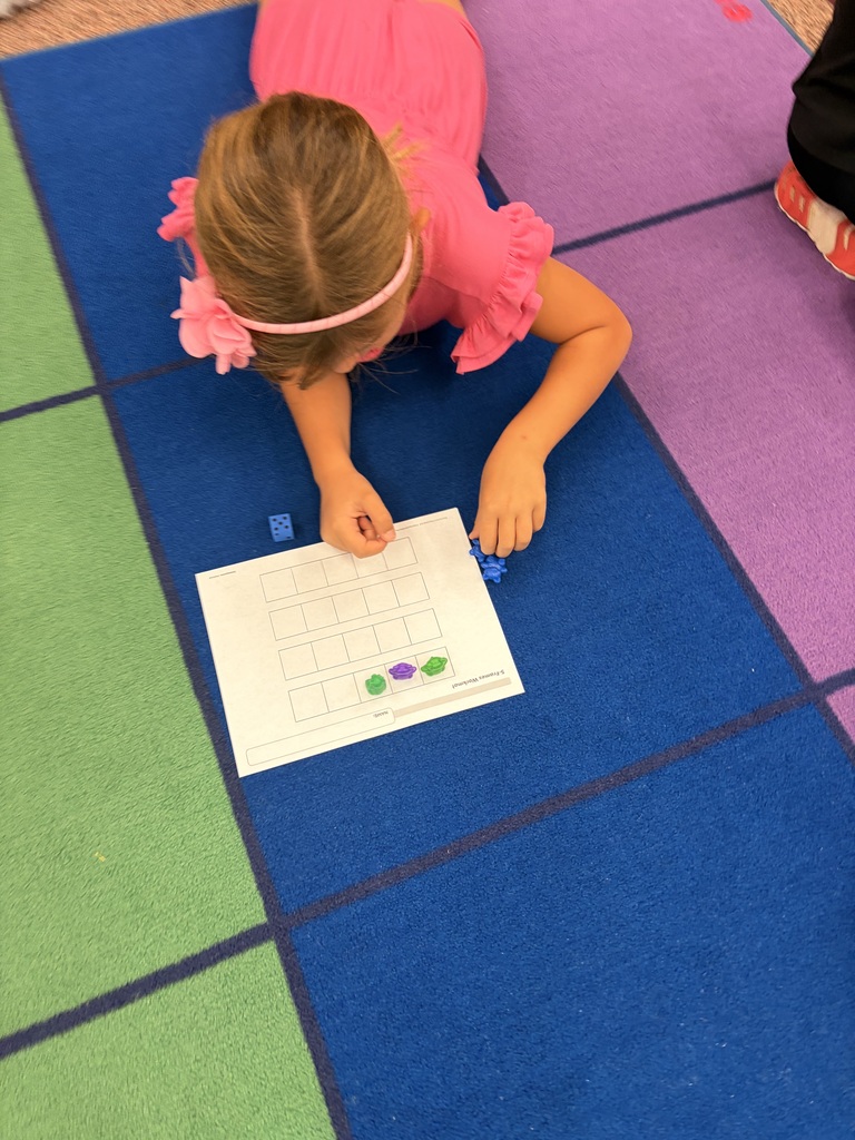 Kindergarten students using counting strategies in math.