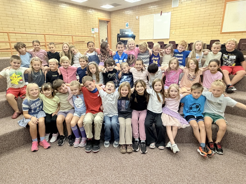 Students participating in a Falcon Flight lesson by playing Four Corners, talking with classmates, and building connections with other Falcons.