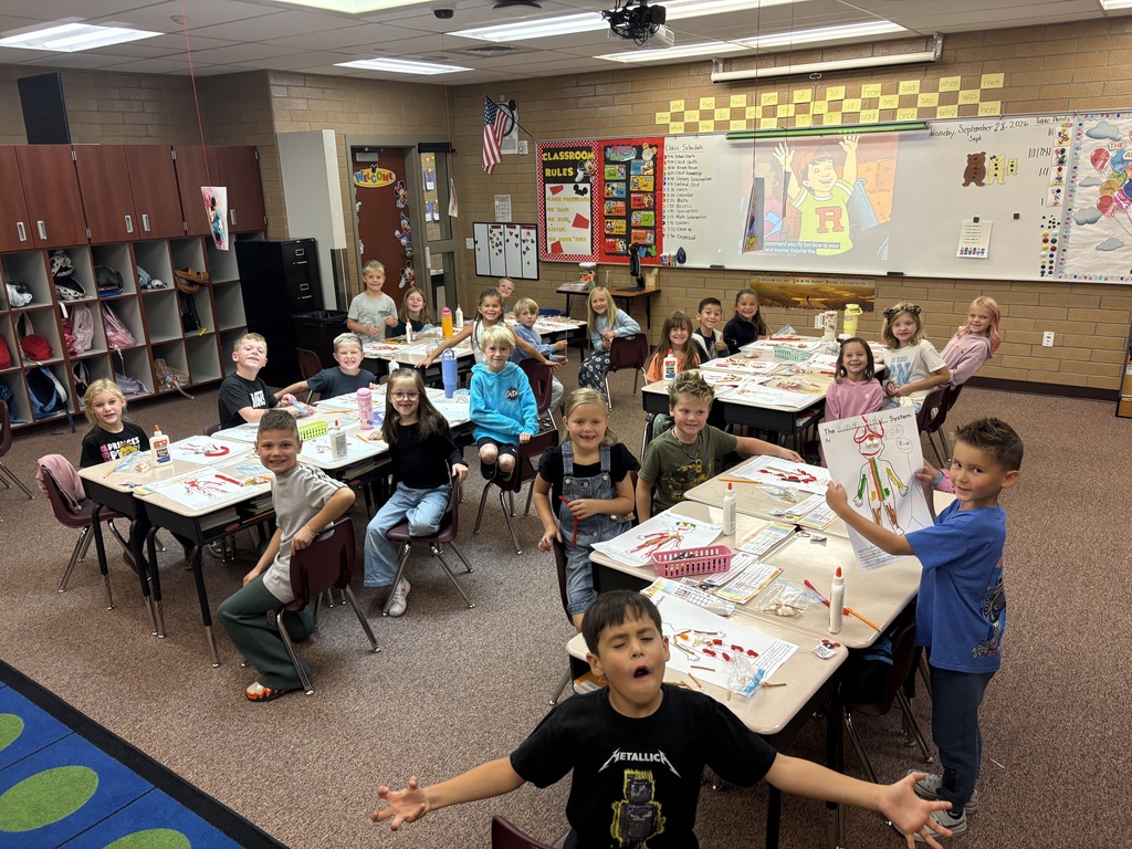 Mrs. Esplin's students in the classroom, showing their projects.