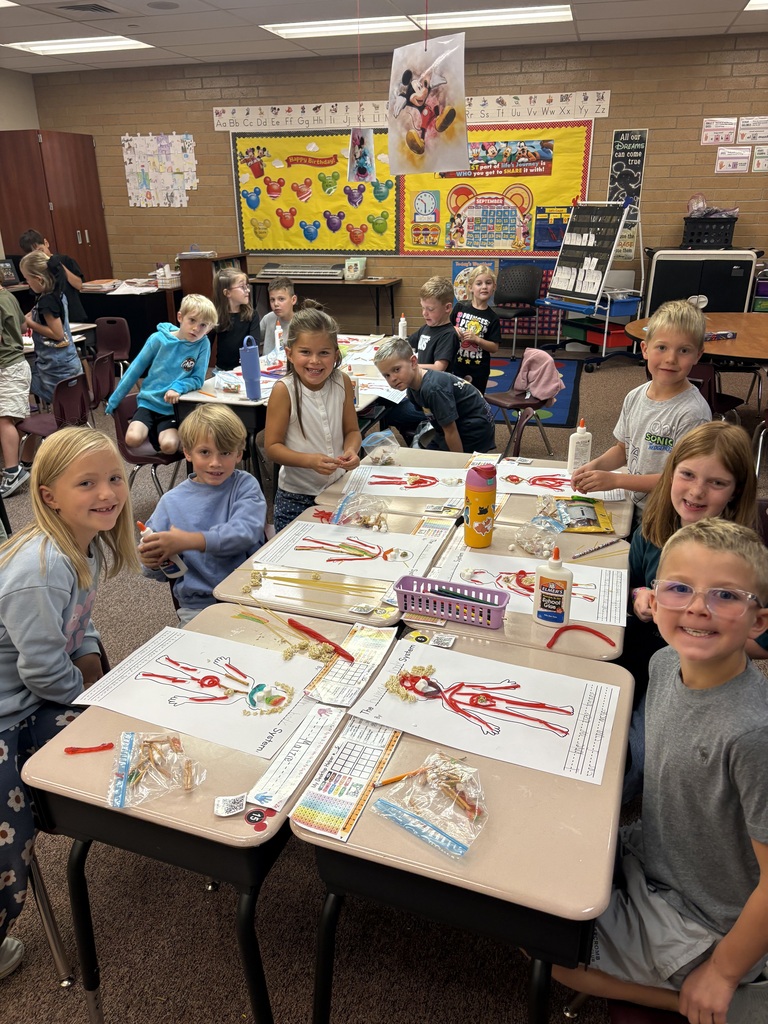 Mrs. Esplin's students in the classroom, showing their projects.