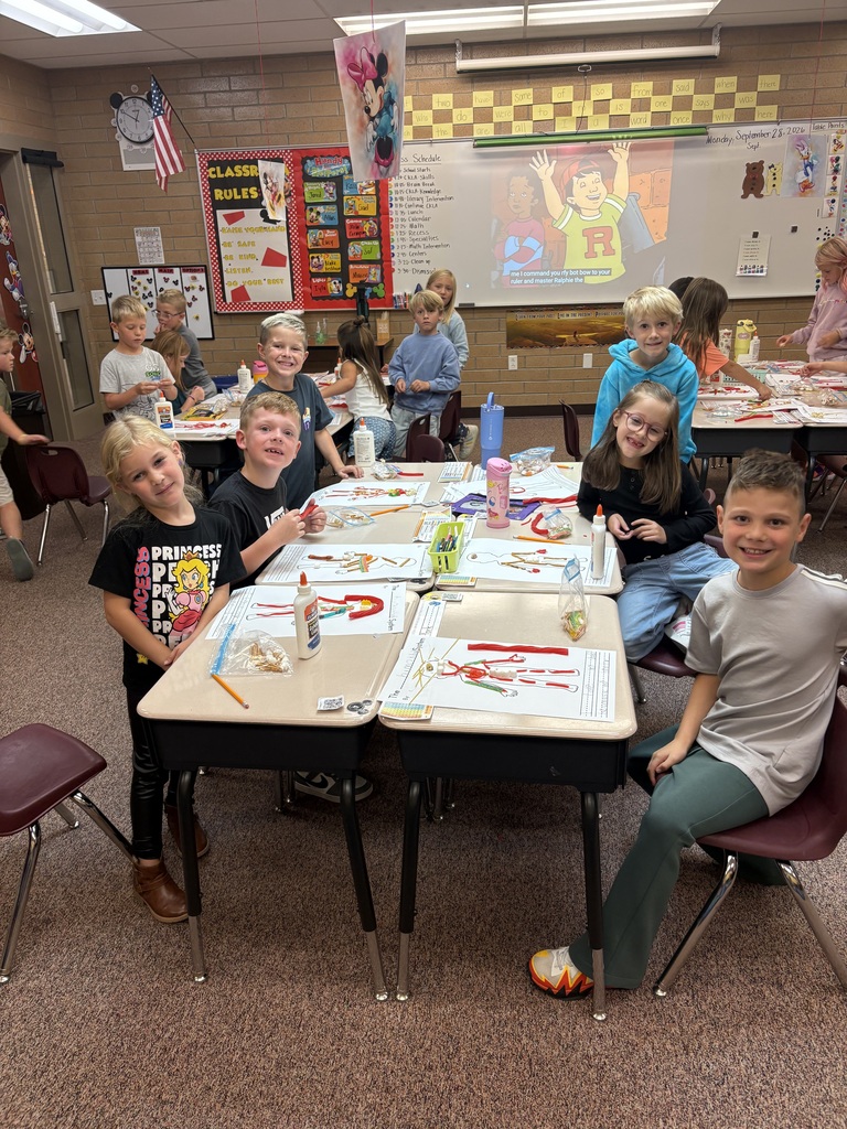 Mrs. Esplin's students in the classroom, showing their projects.