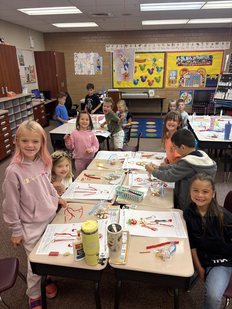 Mrs. Esplin's students in the classroom, showing their projects.
