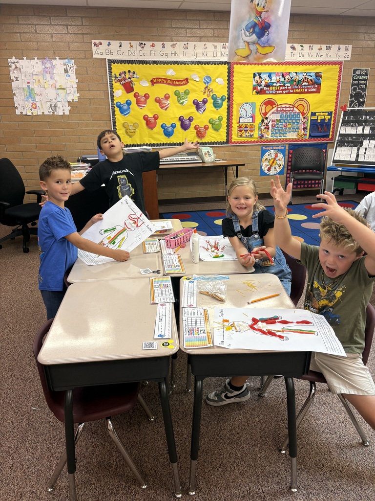 Mrs. Esplin's students in the classroom, showing their projects.