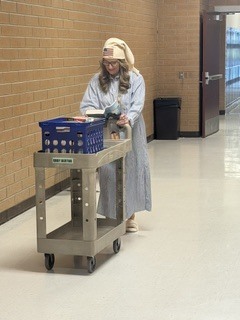 Ms. Thompson on Read-a-thon Day! Walking around reading and making sure everyone had a book to read.